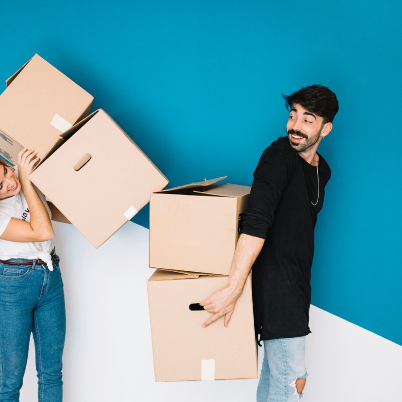 couple-moving-new-flat-with-boxes_23-2147707114